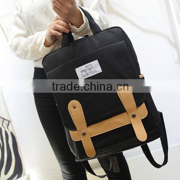 blue canvas travel backpack with laptop compartment