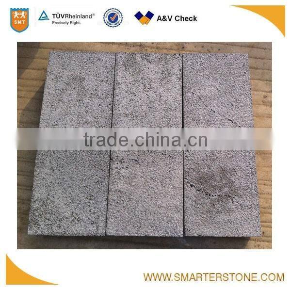 Bush hammered paving stone basalt with honeycombs