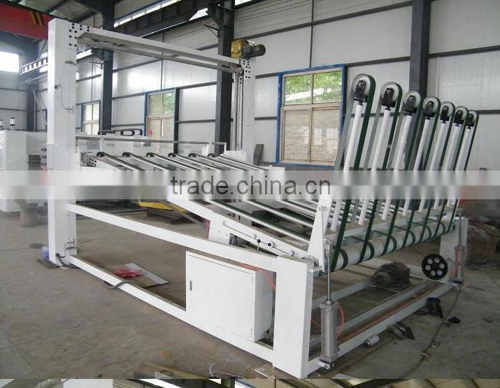 Automatic corrugated paperboard stacking machine