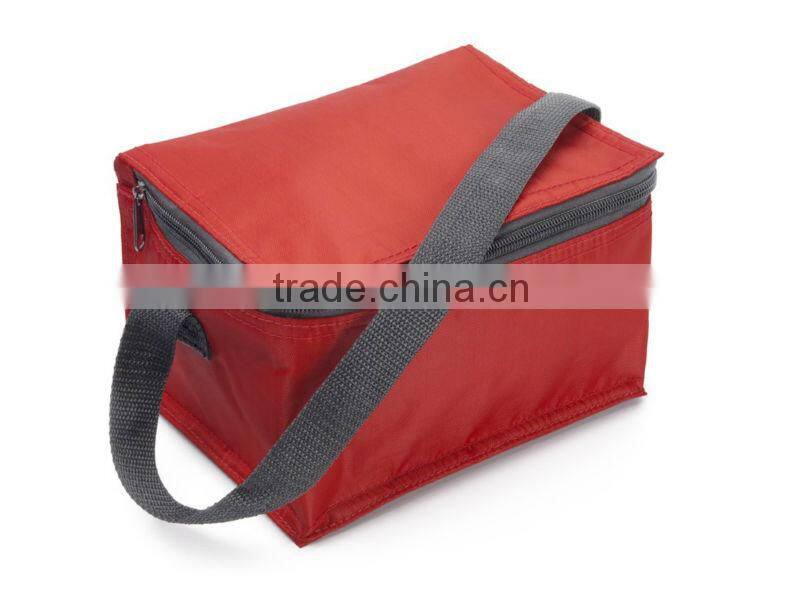 Material cooler bag with a carry handle and a zipped main compartment