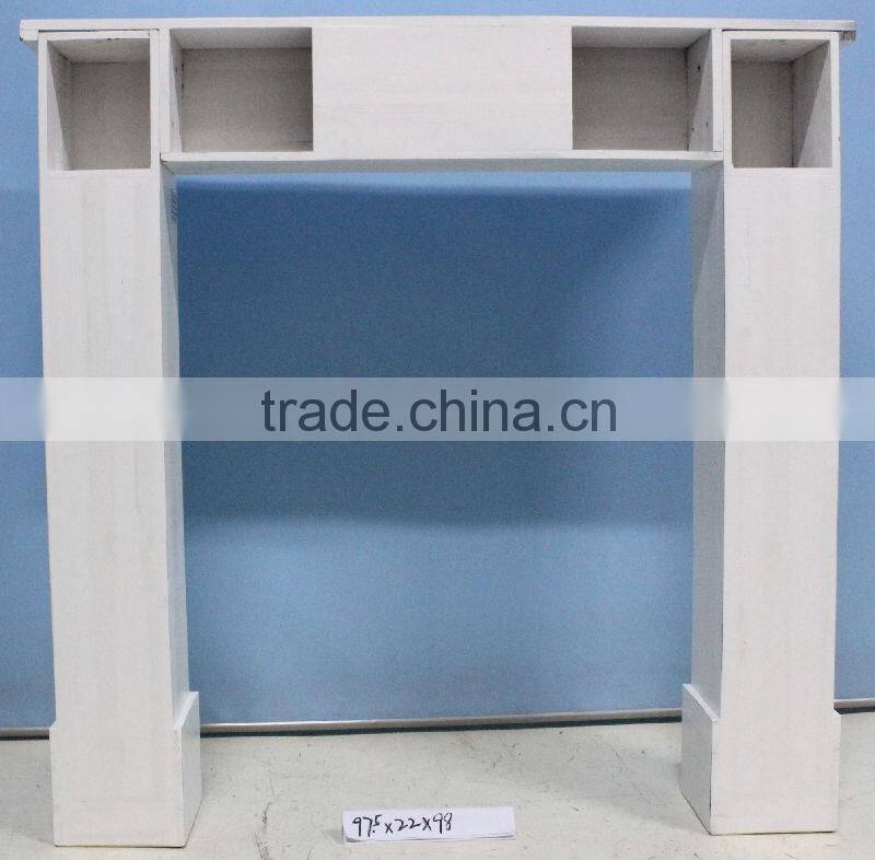 White antique wooden fireplace mantel