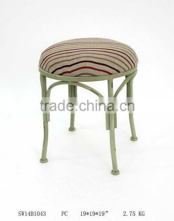 tubular metal chair with linen cushion
