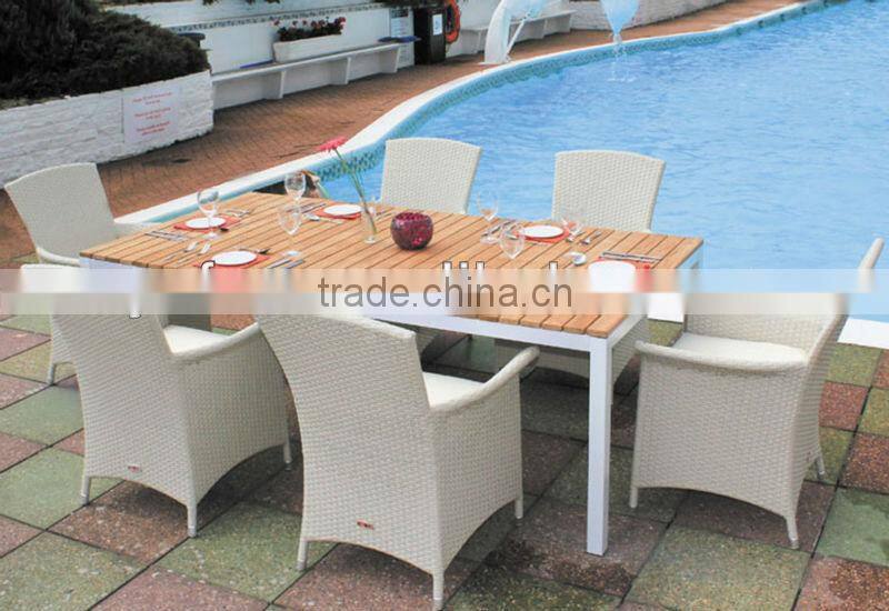 space-saving rattan hideaway dining table and chair set