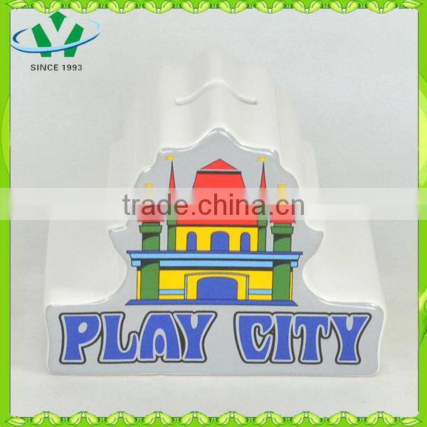 Ceramic piggy bank counting money castle house