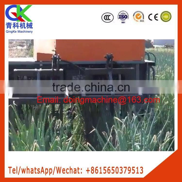 A tractor serves several purposes Green Chinese onion harvester