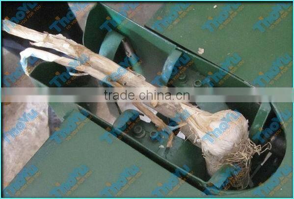 Garlic tail and stem cutting machine