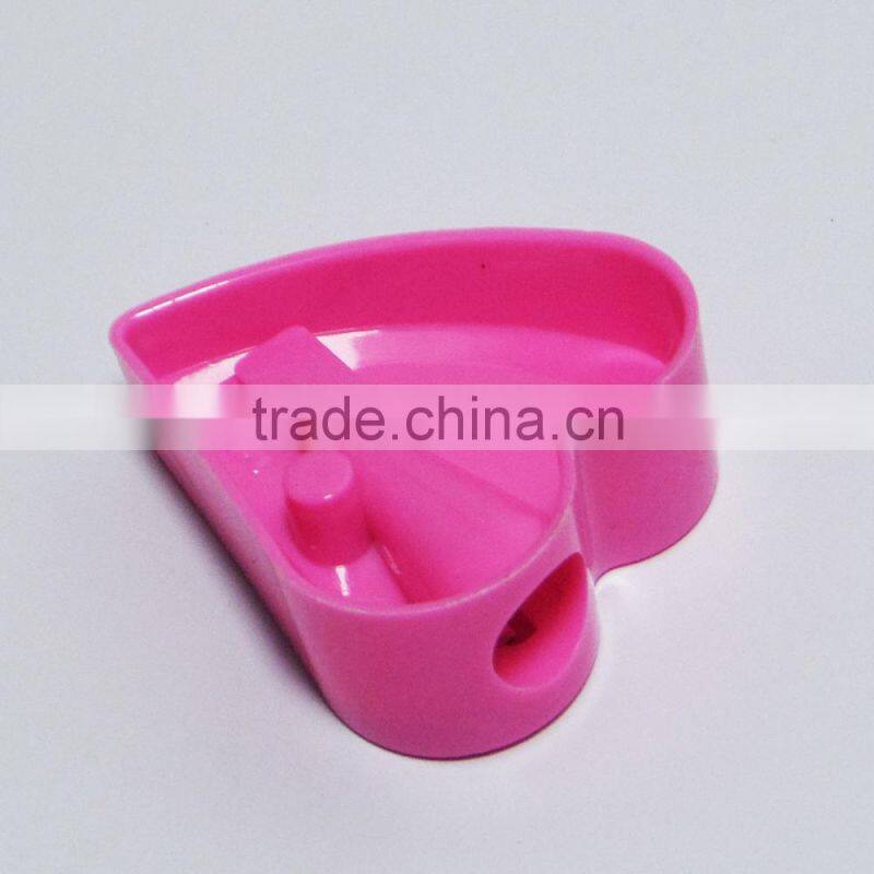 One hole plastic novelty heart shaped pencil sharpener