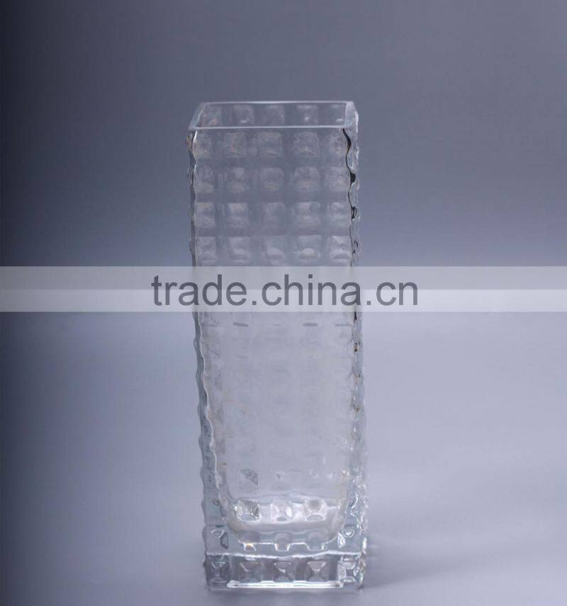 square glass vase with bubbles in surface