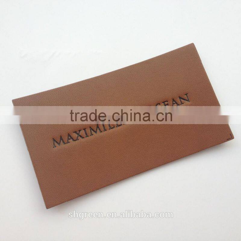 Soft debossed company name leather tags for suits
