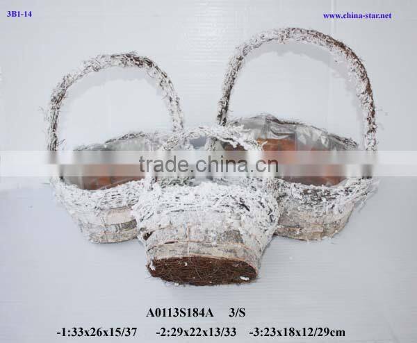 handmade birch basket with falling snow