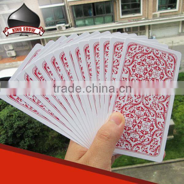 paper and plastic tarot cards packed into tin box for game