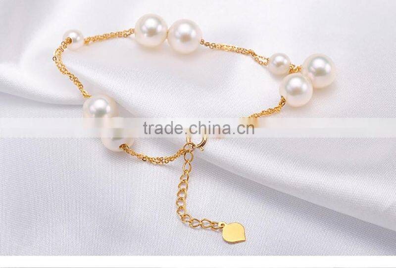 akoya cultured pearls bracelet with white/golden pearls in 18k gold chain