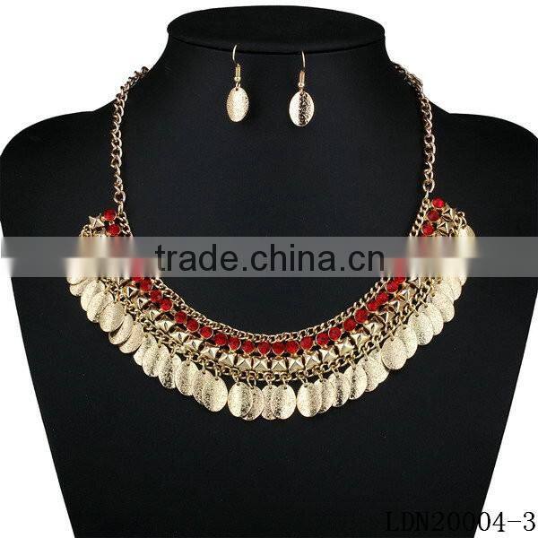 Gorgeous oval gold disc chain with crystal necklace with matching earrings