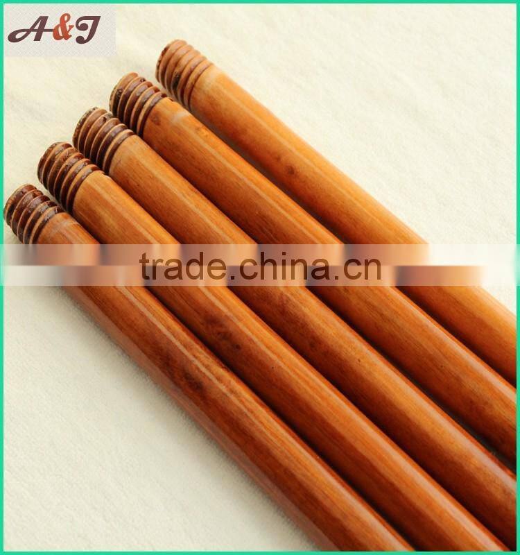 varnished wooden broom handle with long hanger