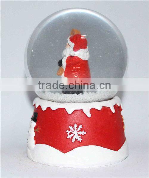 Resin santa snow globe with blowing snow