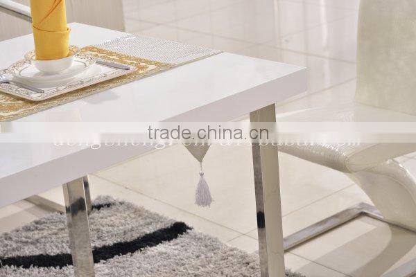wooden dining table with stainless steel legs