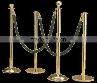 Painting black base of stanchion post for event with rope