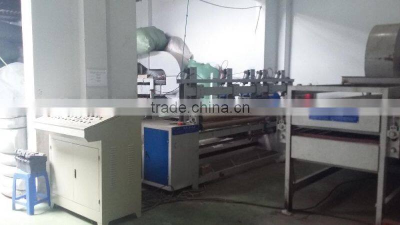 Nonwoven waddings edge cutting and rolling machine , trimming and coiling machine