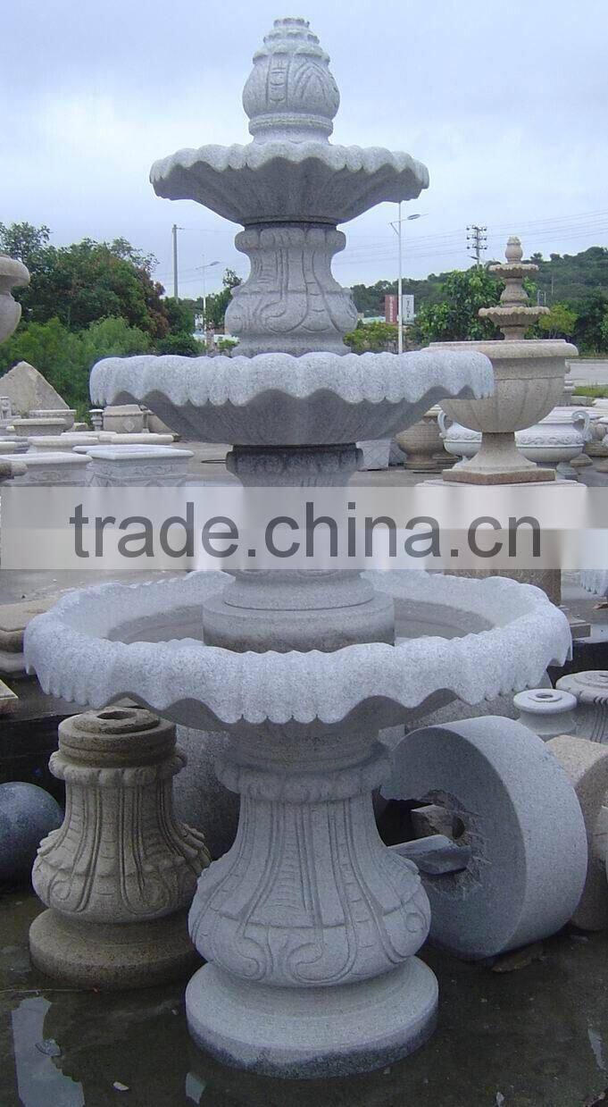 dark granite stone fountain garden