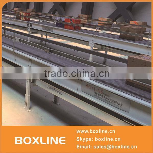 Flexible mesh conveyor for heavy cartons