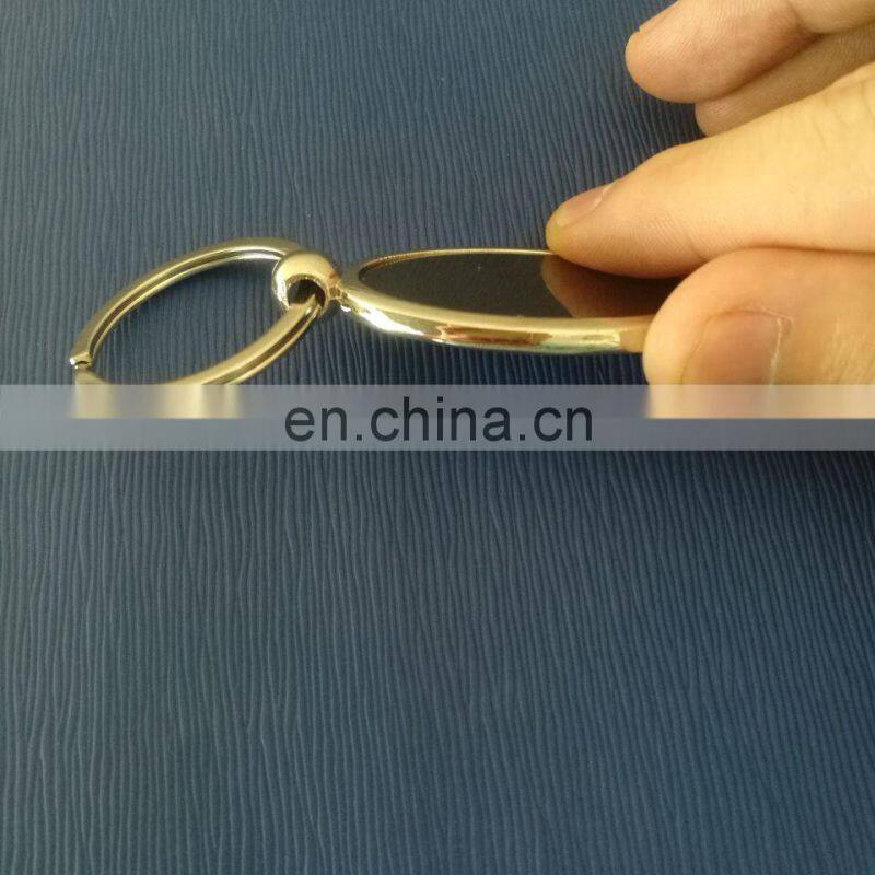 Metal oval key chain with logo in epxoy