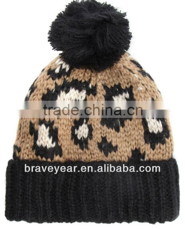 knitted leopard print beanie hat with black pom and matching cuff