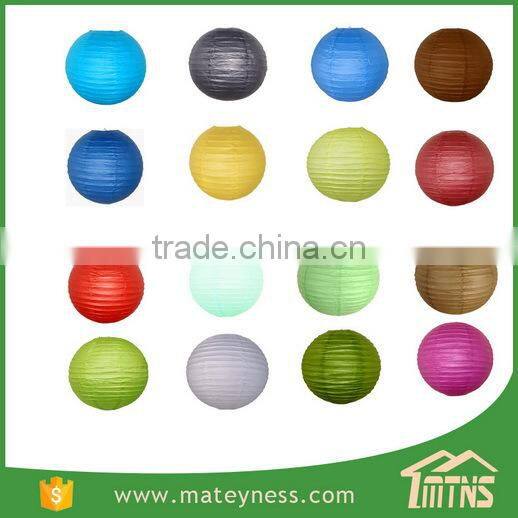 Round Hanging Fabric Lanterns In Trees