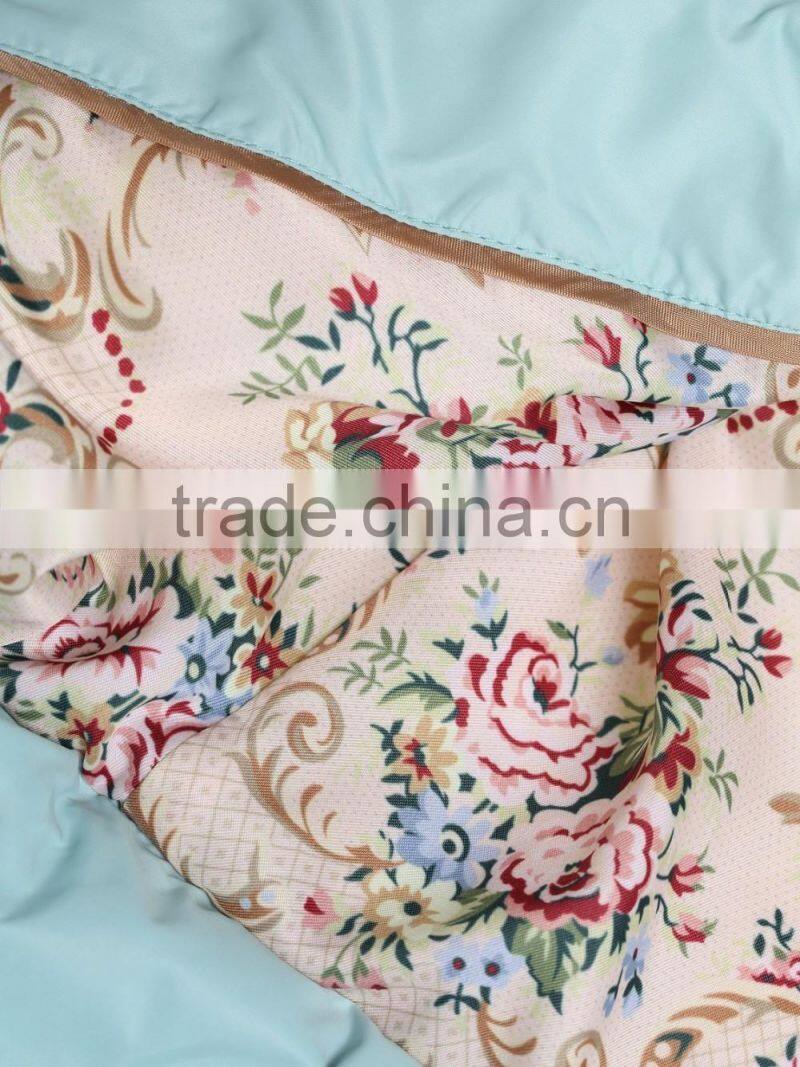 Womens light blue slim fit button-up down jacket with adjustable elastic belt