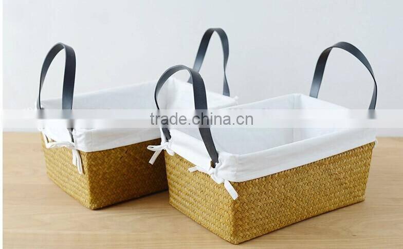 basket made of natural straw seagrass for housewaring with handle and lining