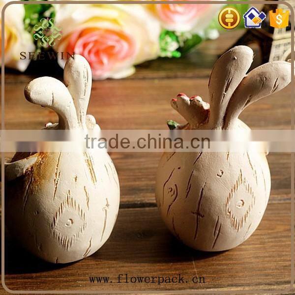 Thin rabbit rabbit couples rustic style to pick a flower