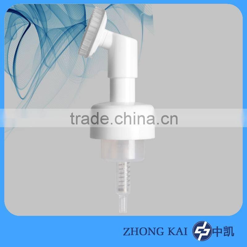 Foam dispenser pump with brush