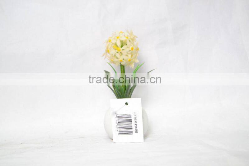 Artificial flower planted in ceramic pot for home decoration