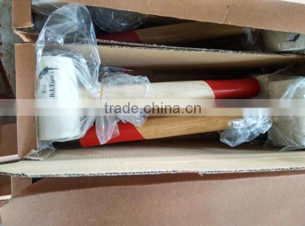 white colored rubber mallet hammer with wooden handle