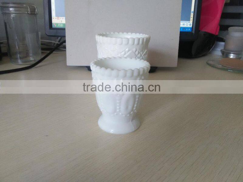 white cup shape candle jar