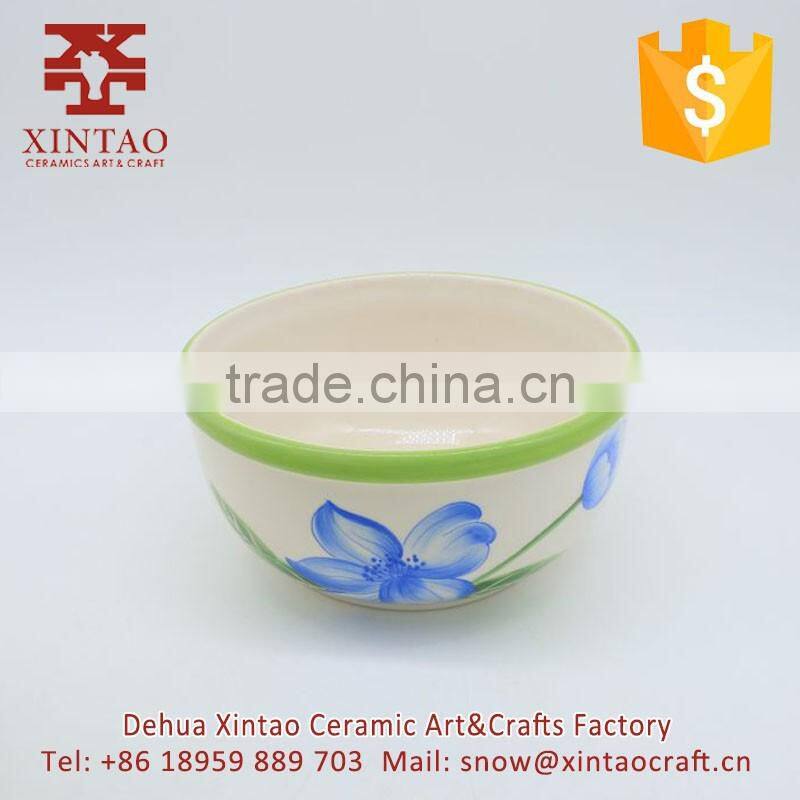Small white ceramic soup bowl with green rim for hotel use