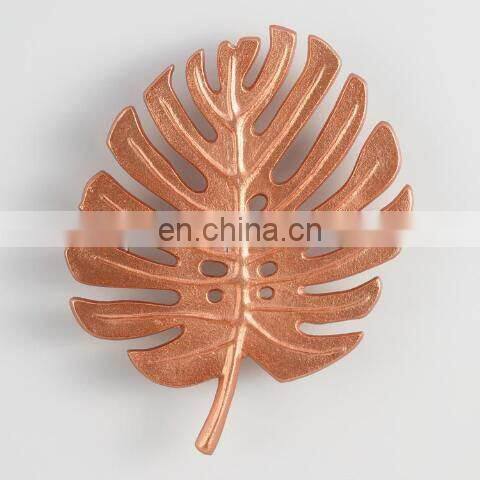 silver flower design trivet