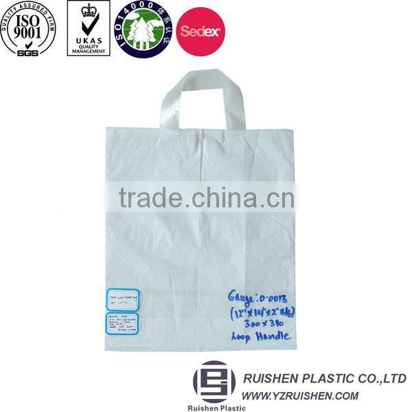 Biodegradable soft loop handle plastic bag with reinforced handle