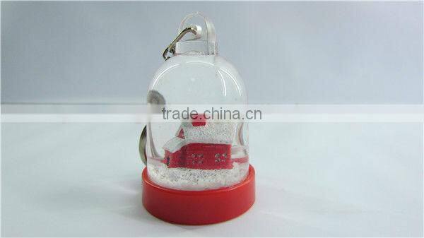 Plastic snow globe penguin key chain
