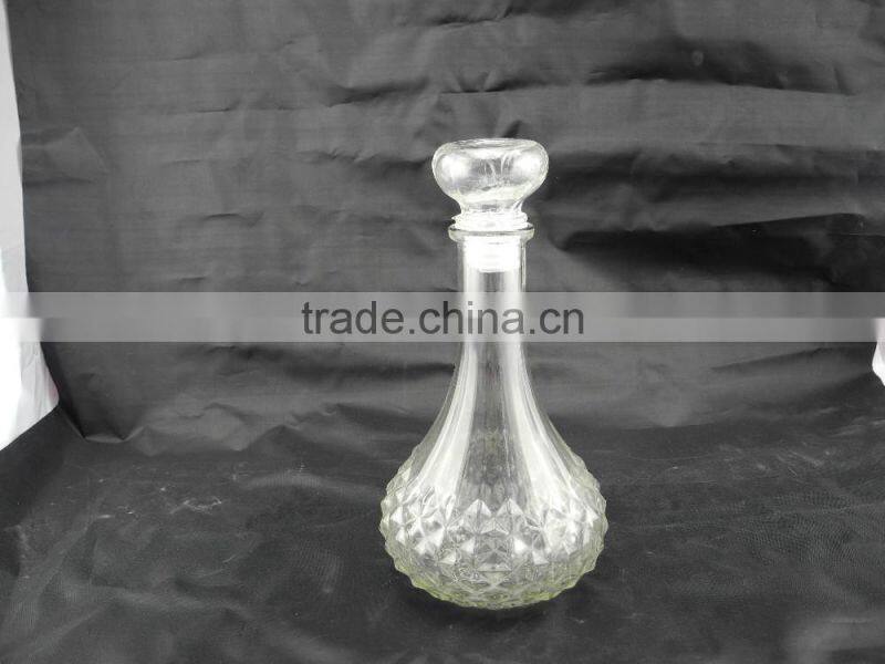 sealed clear glass drinking bottle with glass cork lid