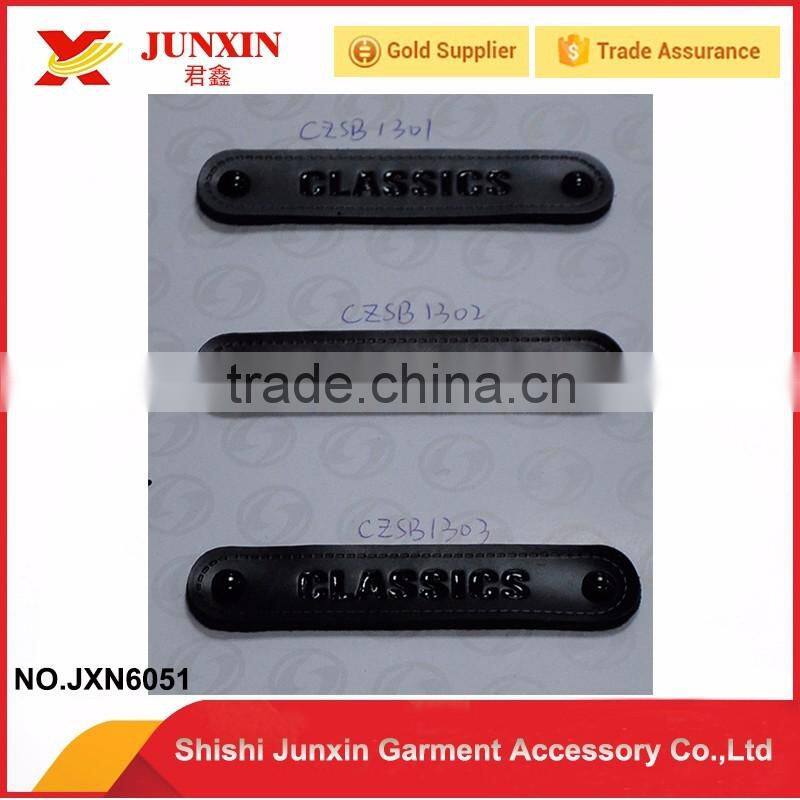 Cheap wholesale custom embossed leather label made in China