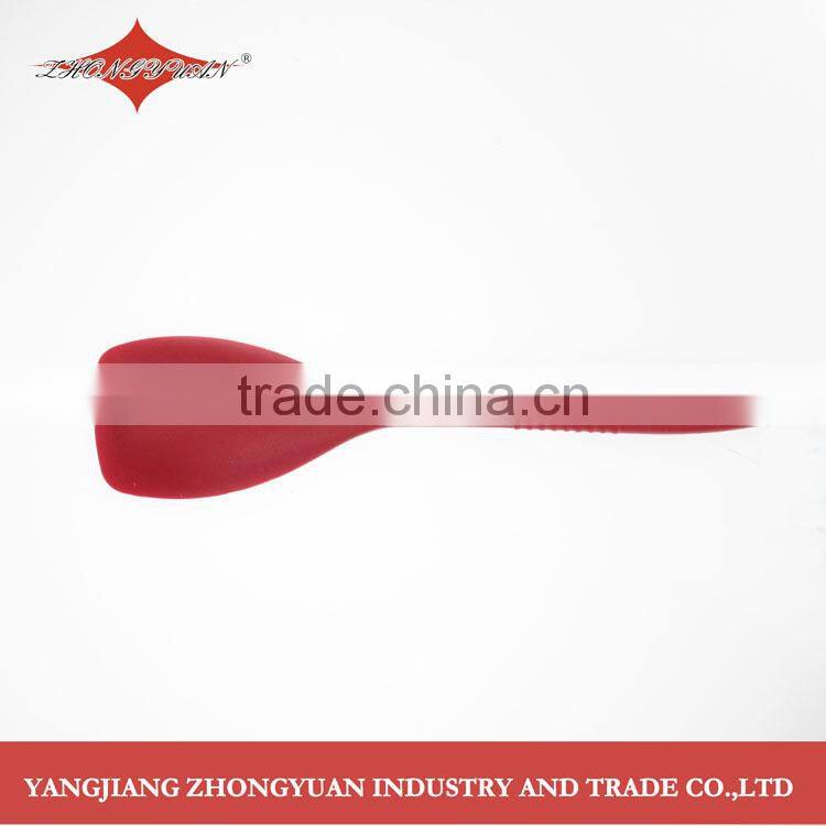 2014 New design midlle size silicone solid spoon with anti-slip soft handle