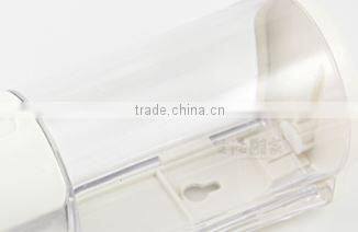 Clear plastic box of commercial liquid hand soap dispenser