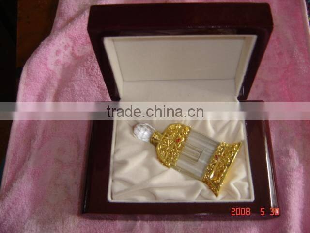 green color crystal decorative perfume bottle with golden flower