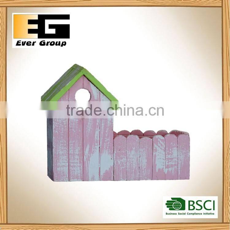 Pink and green house pot garden