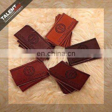 high quality customized private brand name logo jeans genuine leather patch in garment