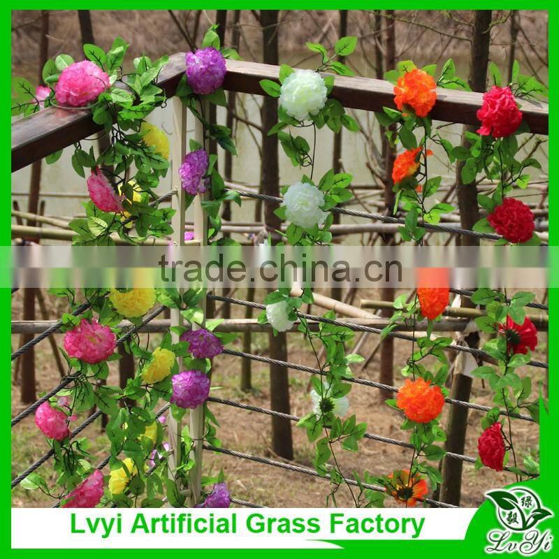 Artificial green leaf vine with flowers for decoration