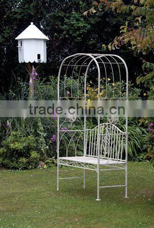 Decorative artistic wedding metal arch with bench