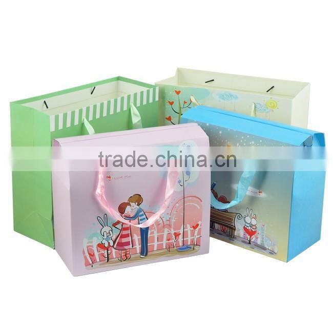 Strong folding top gift packaging paper bag with ribbon