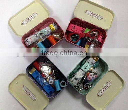 retro sewing kit in tin