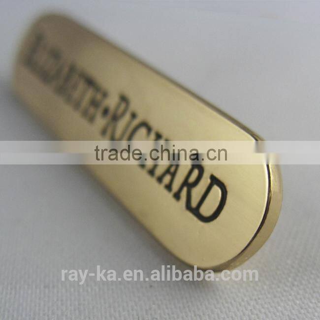 small metal logo name plate